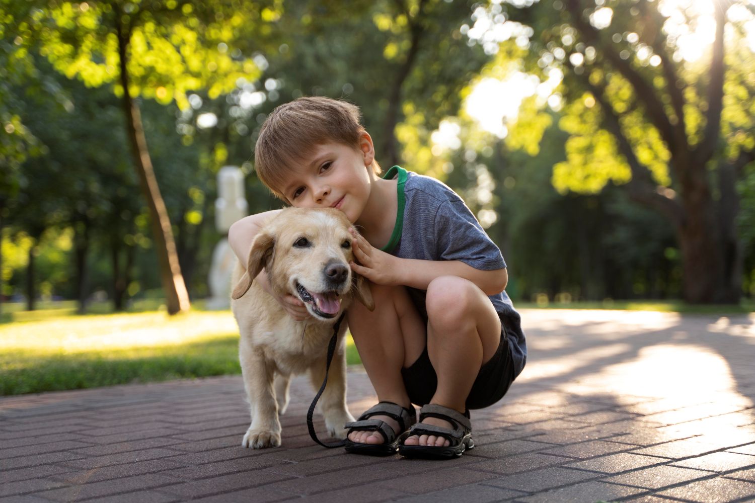 child hugging dog